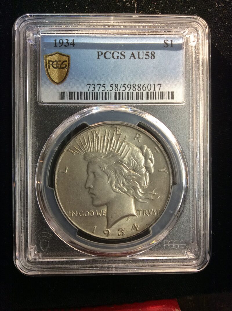 1934 Peace Dollar in a PCGS AU 58 Holder