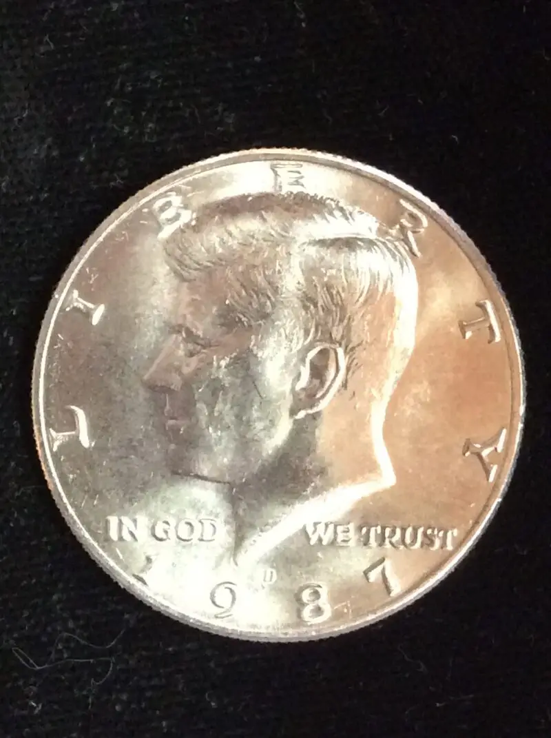 1987-D Kennedy Half Dollar in GEM BU MS65 Condition from an UNC. Mint Set