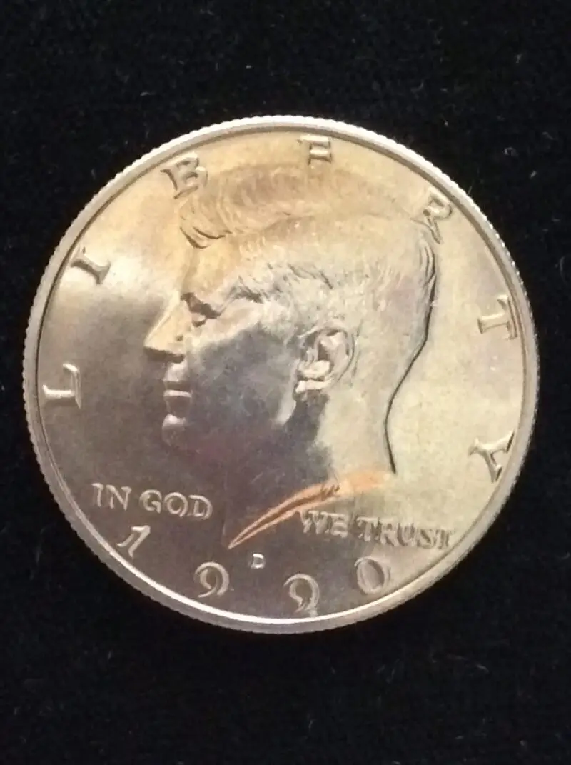 1990-D Kennedy Half Dollar in GEM BU MS65 Condition